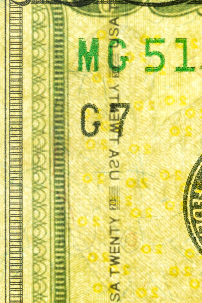 istock Plastic security strip inside 20 USD banknote. Security strip on American banknote created to prevent counterfeiters. 1198867640