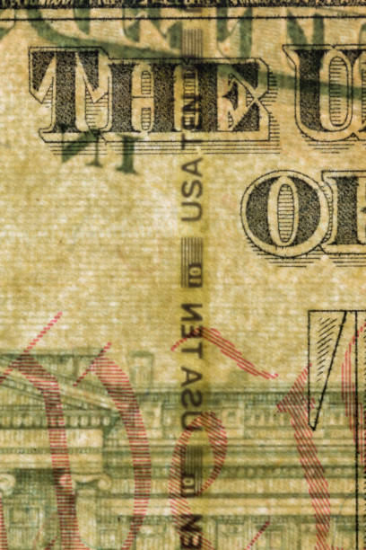 istock Plastic security strip inside 10 USD banknote. Security strip on American banknote created to prevent counterfeiters. 1198868370