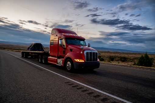 Big freight truck on the open highway heading to their destinations to make the deliveries