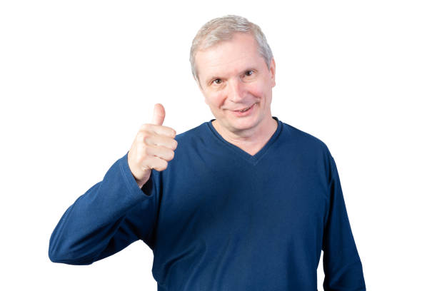 istock Elderly man shows thumbs up. Isolated on a white background. 1198877817