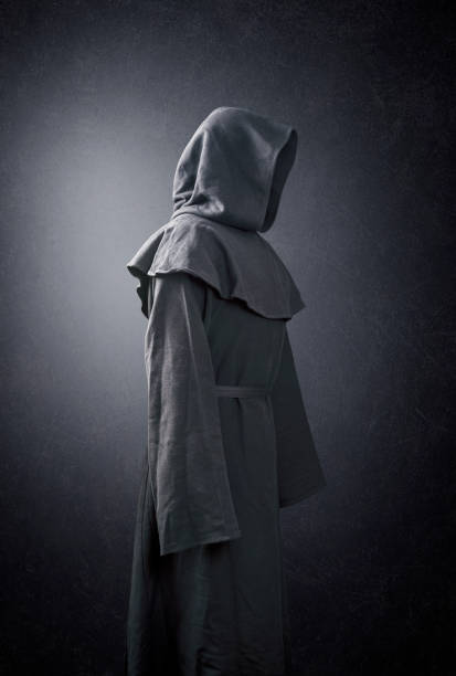istock Scary figure in hooded cloak 1198878377