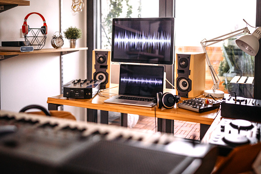 Interior of home recording studio with dj sound mixing equipment
