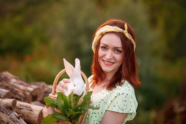 The bunny rests on the girl's shoulder.