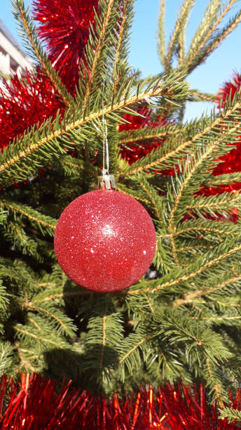 istock New Year decoration with bright red ball and evergreen branches 1198887181