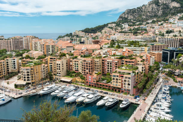 Principality of Monaco - April 14, 2018 - City skyline with luxury yacht in Port of Hercule on the French Riviera.