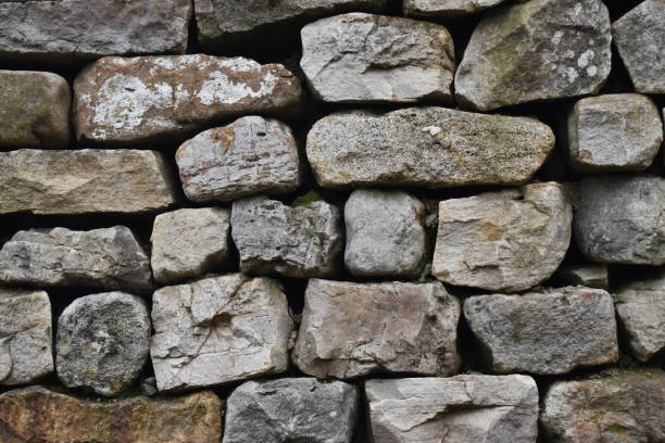 istock Close up of natural stone wall texture background pattern 1198889938