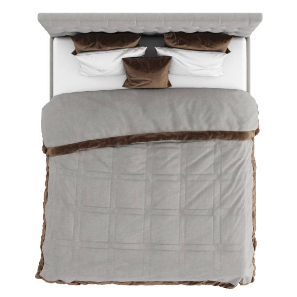 istock Gray bed with a high quilted headboard and gray-white bedding with a brown trim on a white background. 3d rendering 1198891972