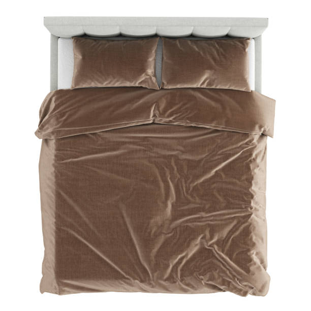 istock A double gray bed with a stitched fabric headboard and brown linen on a white background. Top view. 3d rendering 1198891992