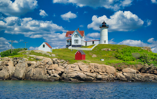 Cape Neddick (Nubble) Light sits on a small rock island  known as the Nubble just off the coast of York, Maine.