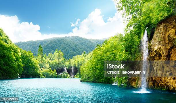 Waterfall In Deep Forest Stock Photo - Download Image Now - Waterfall, Sky, Mountain