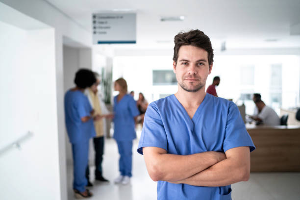 portrait of male nurse at hospital - portrait doctor paramedic professional occupation imagens e fotografias de stock