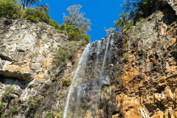 istock Water flowing from over cliff face 1198900884