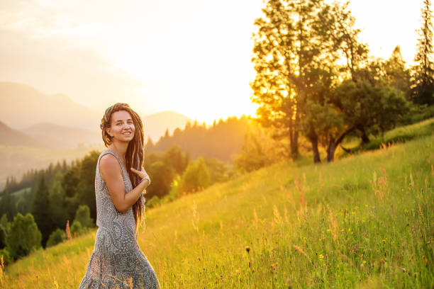istock Beautiful dreadlock woman in mountains 1198902007