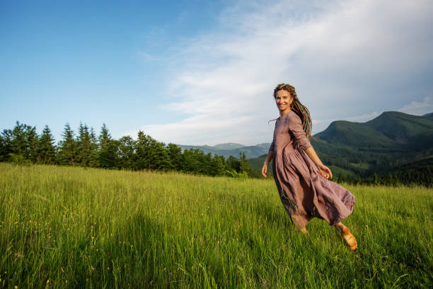 istock Beautiful dreadlock woman in mountains 1198902009