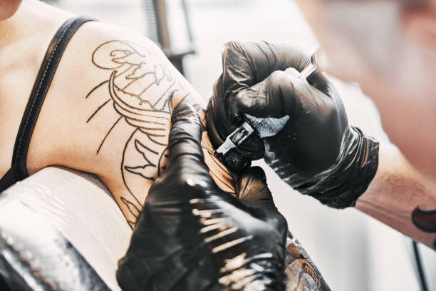 istock Tattooing a shoulder. Close-up shot 1198903699