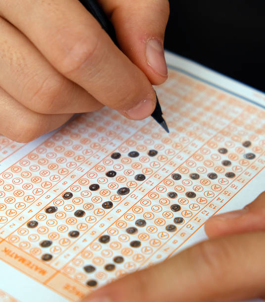 istock marking optical paper, marked question options and optical exam paper, 1198904087