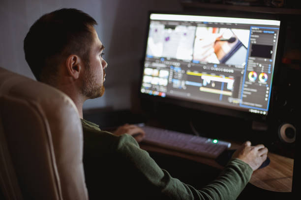 istock Video montager mounts video at desktop. Home workstation 1198906209