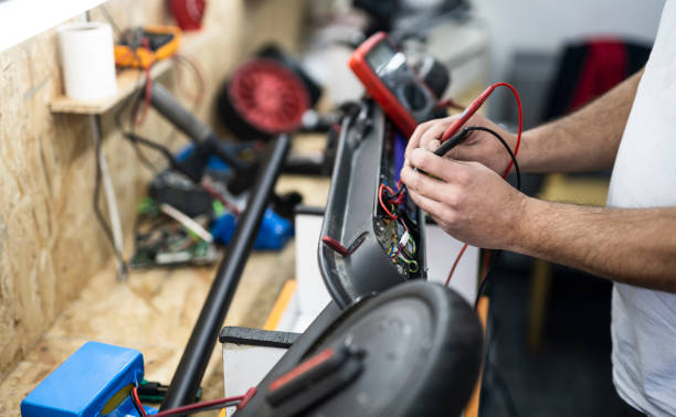istock Repair of electronic devices. Microelectronics engineering and technology concept. Electric scooter service 1198918028