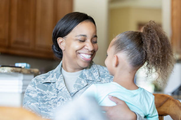 istock Soldier mother reuniting with daughter 1198926247