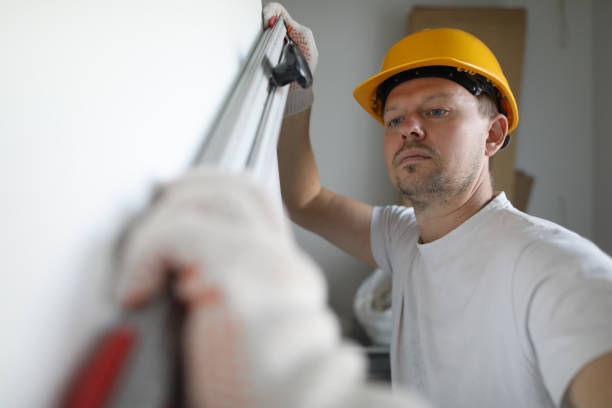 istock Male inspector in protective gloves hold building 1198926287