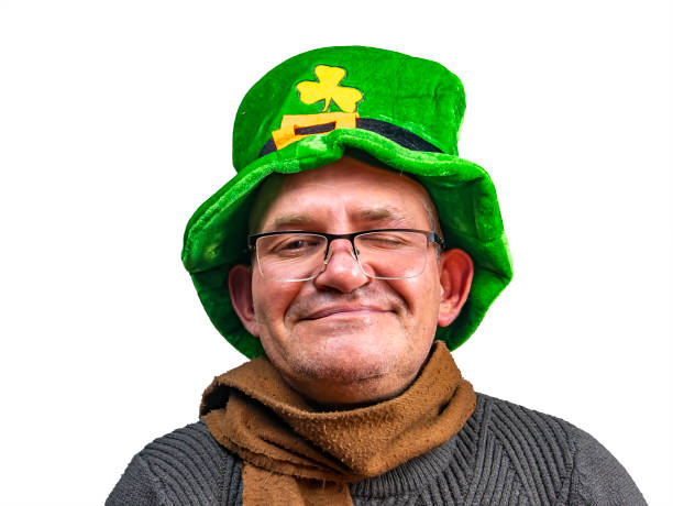 istock St. Patrick in a green top hat with clover. 1198927379
