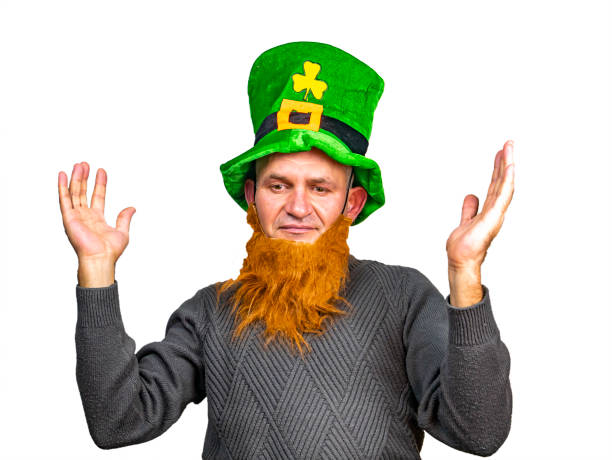 St. Patrick in a green top hat with clover. St.Patrick 's Day. Background image. Place for text. Male model.