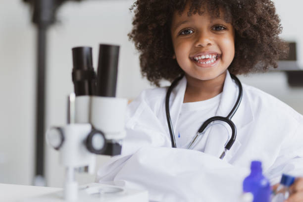istock Young African Male Elementary Student in Science Class stock photo 1198937554