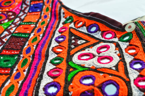 colourful indian traditional ethnic ware for woman or girls gujarat, india. handmade tribal skirt with embroidery and mirror work. wedding dress of rural women,navratri  traditional dress view,embroidery homework - christmas quilt craft patchwork imagens e fotografias de stock