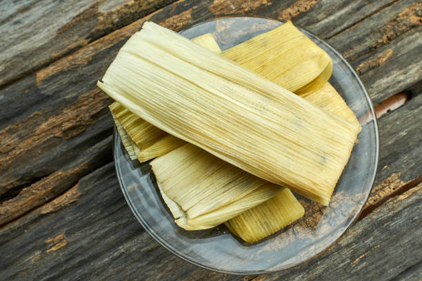 istock Sweet and creamy corn wrapped in corn husks 1198945442