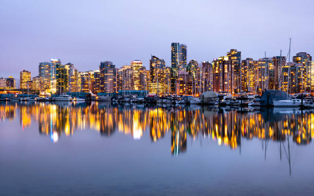 istock Illuminated Vancouver skyline reflection on the water 1198947077
