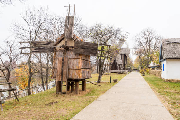 Authentic old wooden windmill from all over Romania in Dimitrie Gusti National Village Museum, an open-air ethnographic museum located in the King Michael I Park, showcasing traditional Romanian village life stock photo