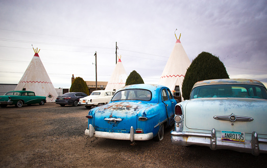Holbrook, AZ, USA: Antique cars at the vintage (1950) Wigwam Motel on historic Route 66 in Holbrook, AZ; the motel is on  National Register of Historic Places.