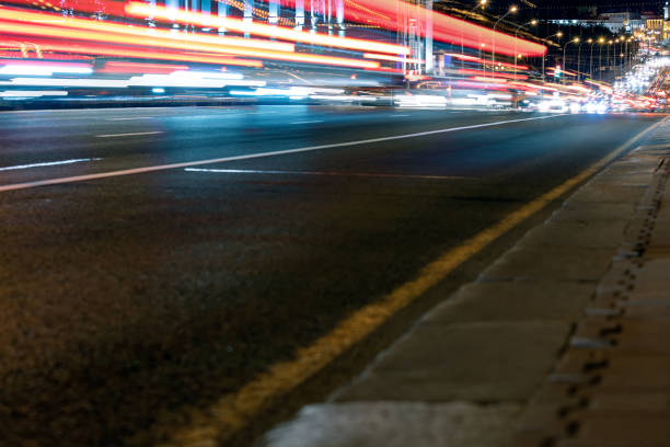 istock colorful light trails from cars in motion. long exposure 1198951971