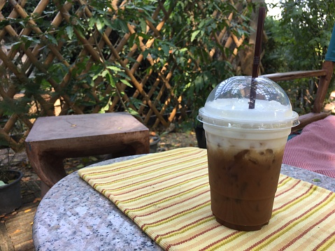 Iced latte coffee in the garden