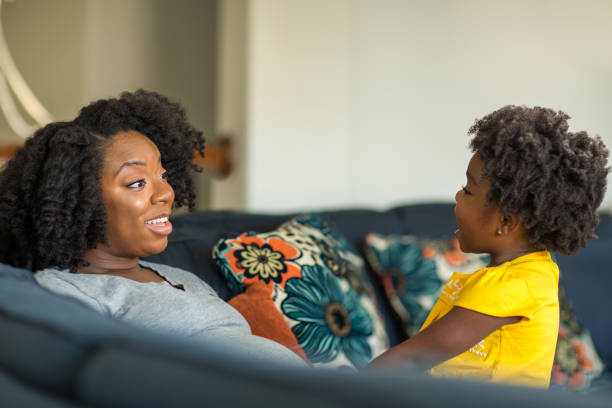 istock African American mother playing and talking with her daughter. 1198952933