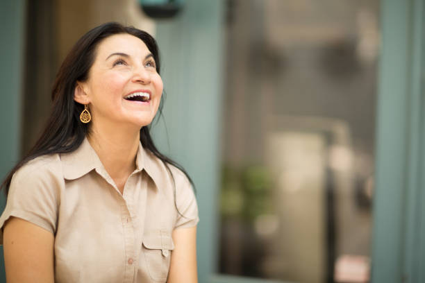 istock Happy Hispnaic woman smiling 1198952945