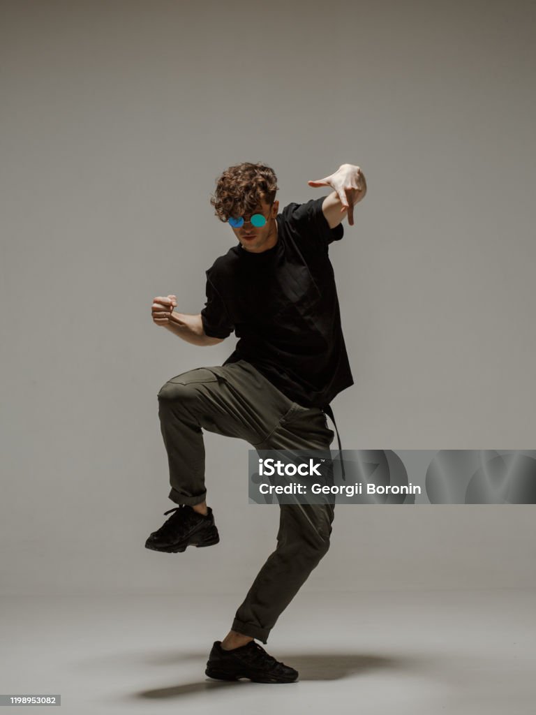 Neutral Dancing Guy Dancing Contemporary Dance In Studio Neutral Grey Background ...
