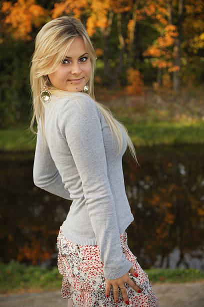 istock Charming young woman in autumn park 119895675