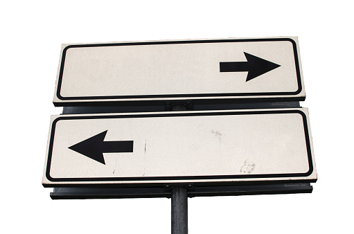 Crossroads Road Sign, Two Arrow on white background, Isolated. Two way blank road sign with copy space. Two arrows on a pole pointing in different directions, isolated on white