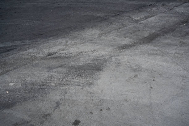 istock Asphalt road with tire tracks 1198958508