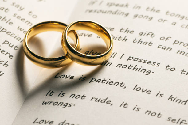 istock Golden wedding rings on bible book 1198962670