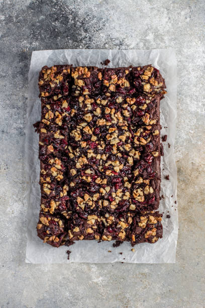 istock Chocolate brownie with cranberries and walnuts 1198963540