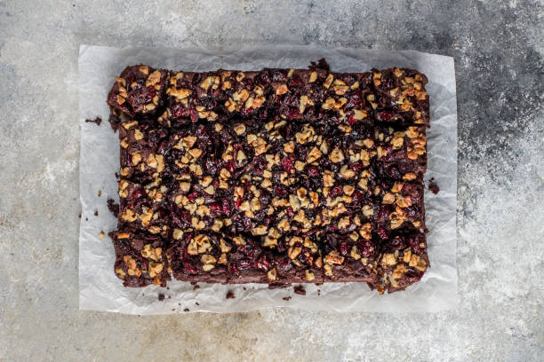 istock Chocolate brownie with cranberries and walnuts 1198963559