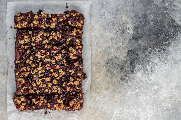 istock Chocolate brownie with cranberries and walnuts 1198963566