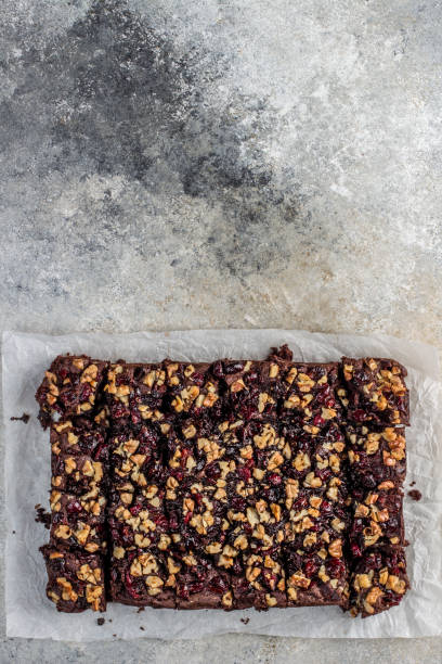 istock Chocolate brownie with cranberries and walnuts 1198963577
