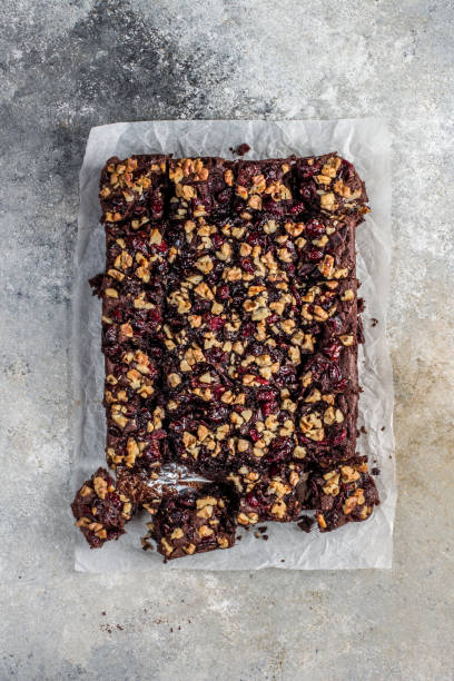 istock Chocolate brownie with cranberries and walnuts 1198963585
