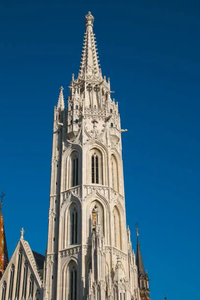 Bell tower of Matthias Church, a Roman Catholic church in front of theFisherman's Bastion at the heart of Buda's Castle District, Europe