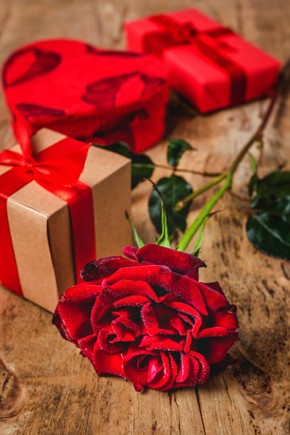 istock Composition of red roses and gift boxes 1198965887
