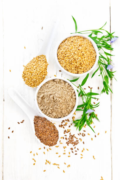 istock Flour linen in bowl with seeds on white board top 1198965943