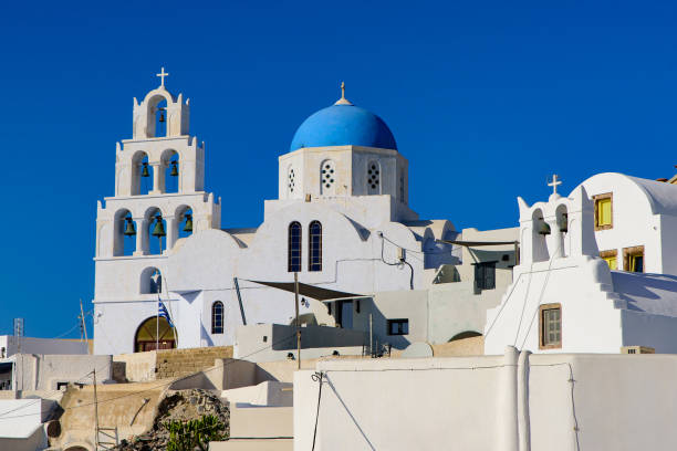 istock Blue domed church in Santorini, Greece 1198967418